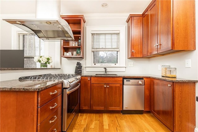 kitchen with island exhaust hood, open shelves, stainless steel appliances, a sink, and dark stone counters