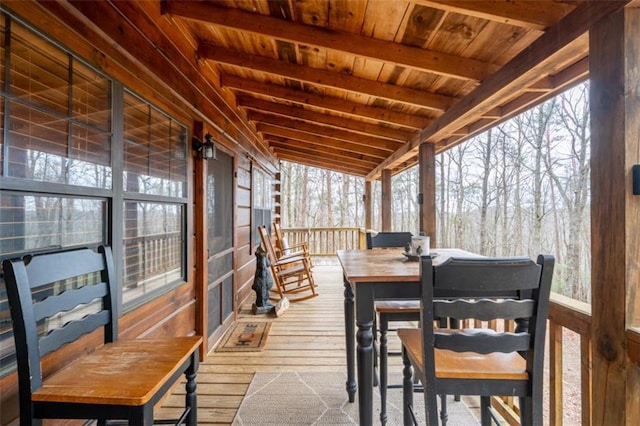 wooden deck with outdoor dining area
