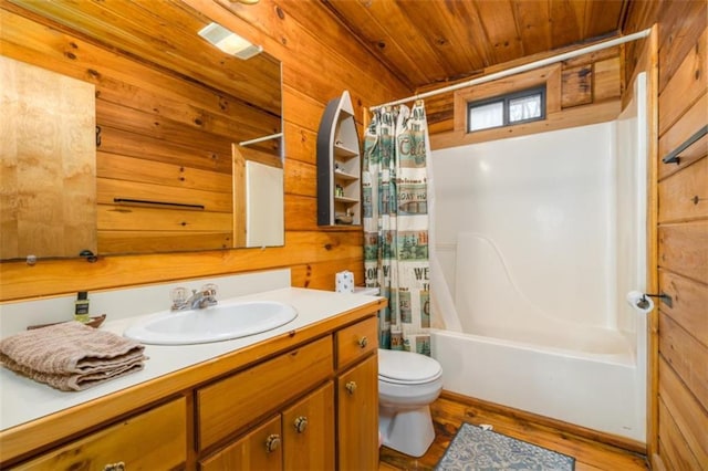 bathroom featuring wood walls, wood finished floors, vanity, wood ceiling, and toilet