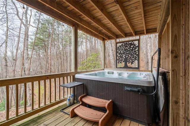 deck featuring a hot tub