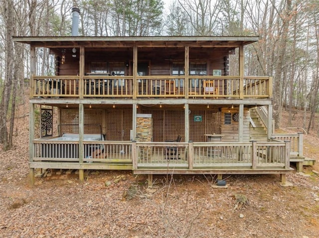 view of front of home featuring a wooden deck and stairs