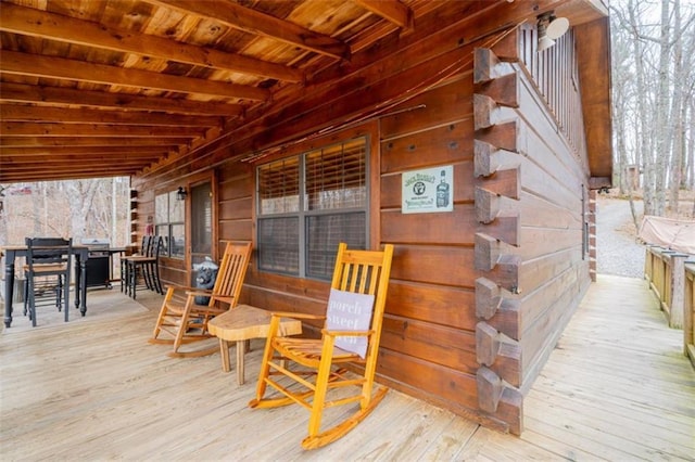 wooden deck featuring outdoor dining space