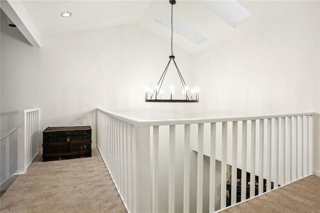 1209 Brookhaven Woods Ct NE, Brookhaven, GA 30319 - corridor with carpet flooring, lofted ceiling, and a chandelier