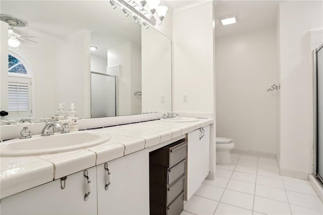 1209 Brookhaven Woods Ct NE, Brookhaven, GA 30319 - full bathroom with ceiling fan, a shower stall, double vanity, and toilet
