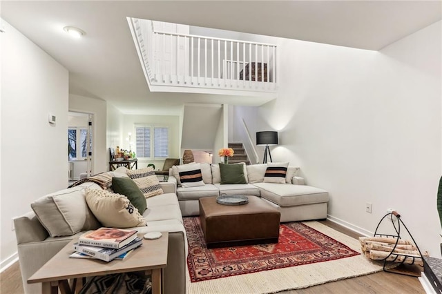 1209 Brookhaven Woods Ct NE, Brookhaven, GA 30319 - living area with wood finished floors, baseboards, and stairs