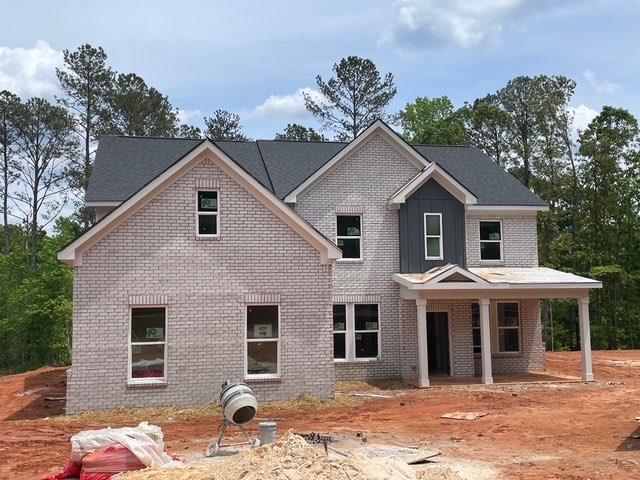 3292 Mill Forest Dr, Conyers, GA 30094 - craftsman house with brick siding and a porch