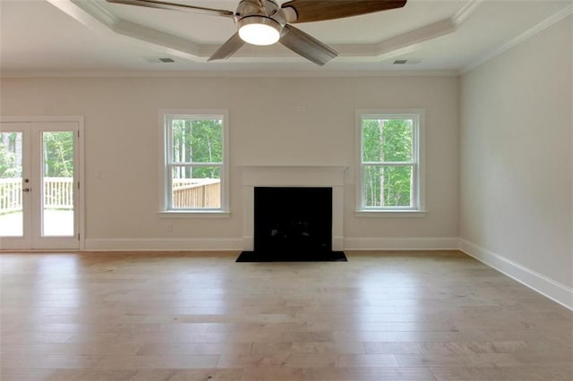 3292 Mill Forest Dr, Conyers, GA 30094 - unfurnished living room with light wood finished floors, ornamental molding, a ceiling fan, french doors, and a fireplace with flush hearth