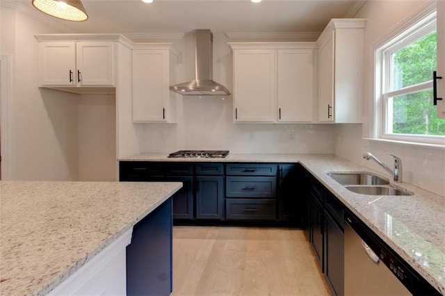 3292 Mill Forest Dr, Conyers, GA 30094 - kitchen featuring wall chimney range hood, appliances with stainless steel finishes, a sink, white cabinets, and ornamental molding