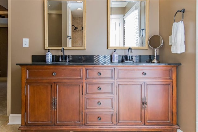 bathroom with tile patterned floors and vanity