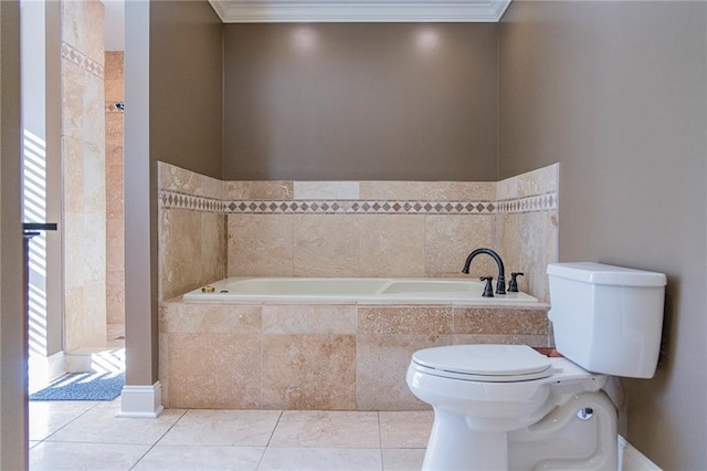 bathroom featuring tile patterned flooring, tiled bath, toilet, and ornamental molding