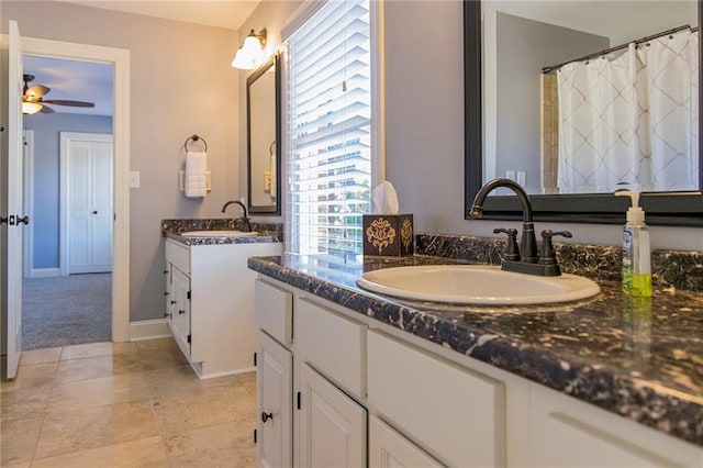 bathroom featuring vanity and ceiling fan