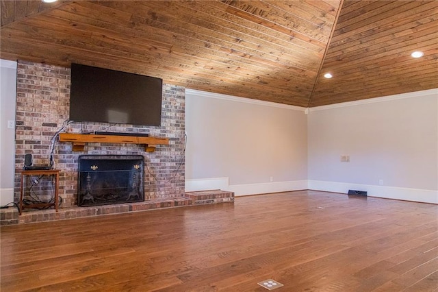 unfurnished living room featuring lofted ceiling, wooden ceiling, ornamental molding, a fireplace, and wood-type flooring