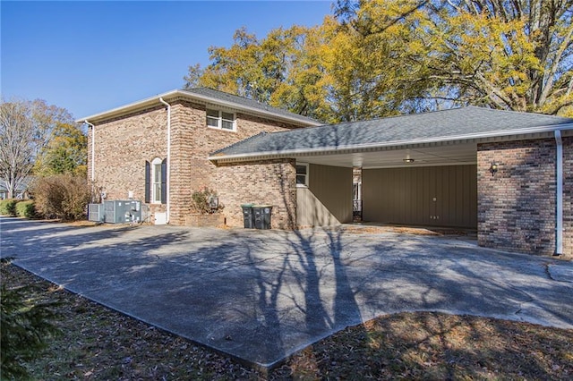 view of side of home featuring a carport