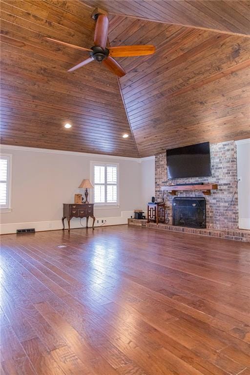 unfurnished living room with hardwood / wood-style flooring, wood ceiling, and a wealth of natural light