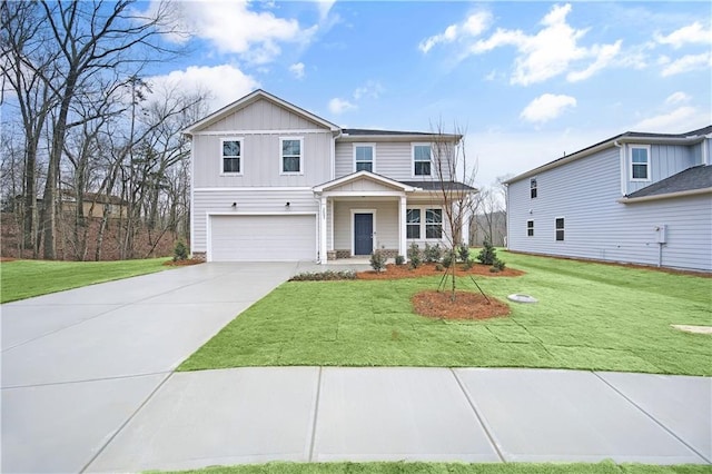 view of front of property featuring a garage, a front yard, and covered porch