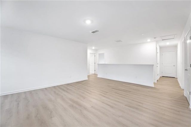 spare room with light hardwood / wood-style flooring