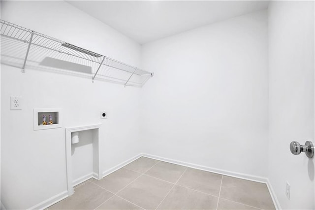 washroom featuring light tile patterned flooring, hookup for a washing machine, and electric dryer hookup