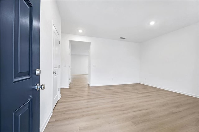 unfurnished room featuring light hardwood / wood-style floors