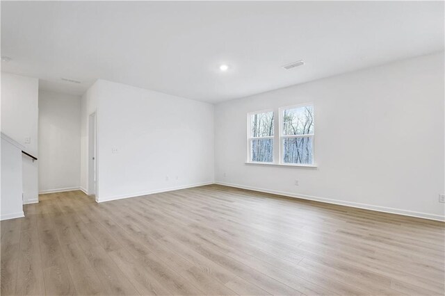 bedroom featuring light carpet