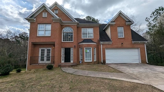 view of front facade with brick siding, driveway, and an attached garage