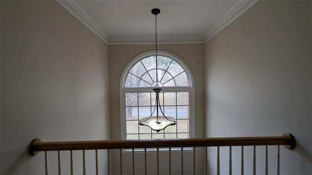 room details with an inviting chandelier and crown molding