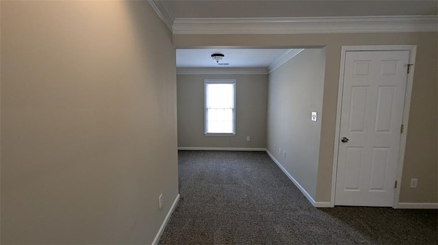 hallway featuring baseboards, dark colored carpet, and ornamental molding