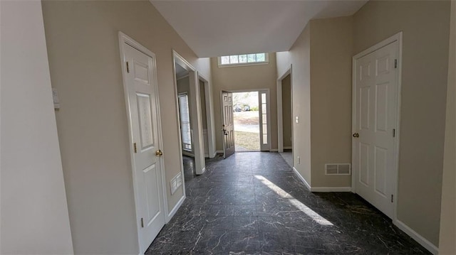 corridor with visible vents and baseboards