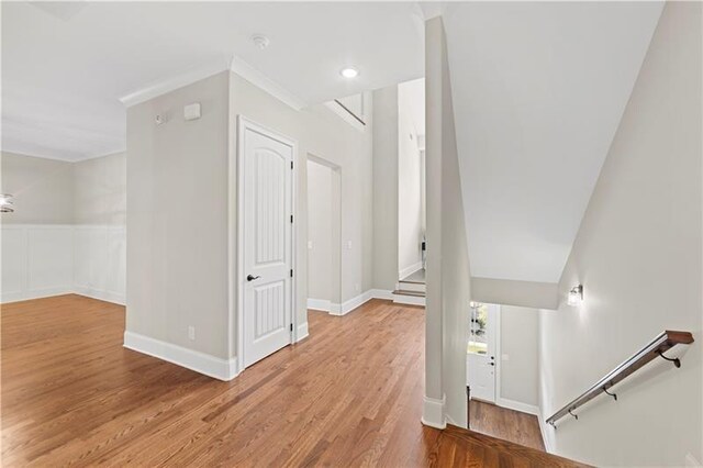 corridor with light hardwood / wood-style floors