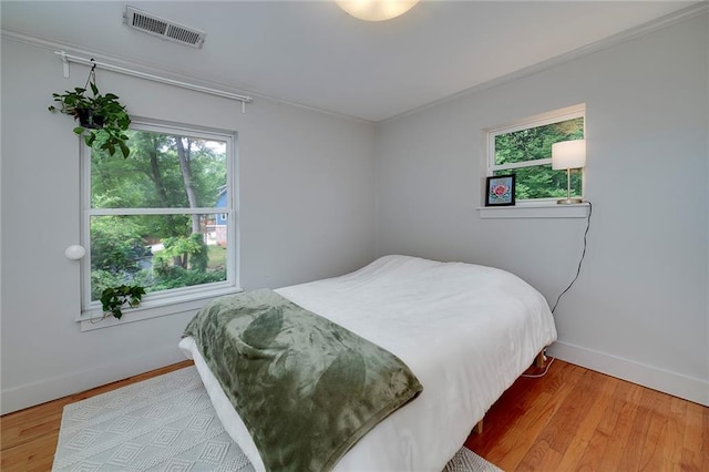 2023 Oakview Rd SE Unit 226, Atlanta, GA 30317 - bedroom featuring wood finished floors and ornamental molding