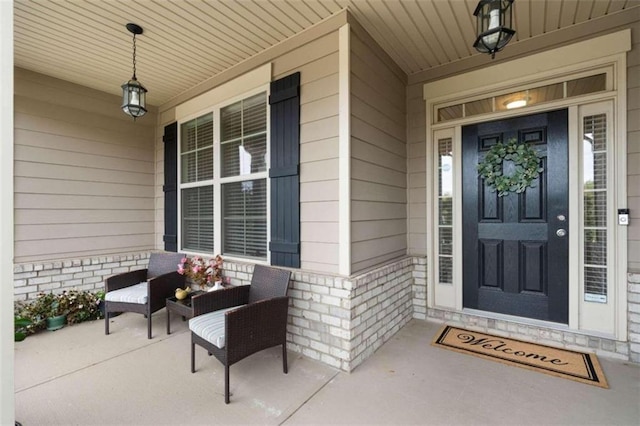 entrance to property featuring a porch