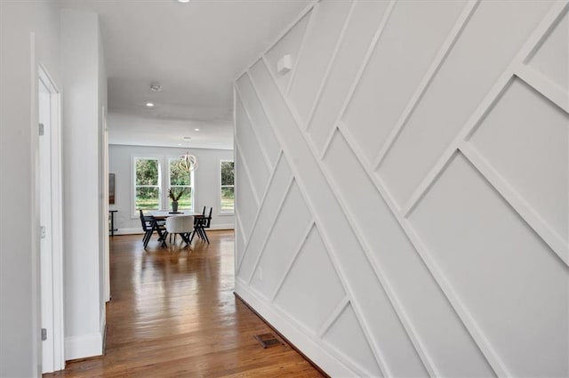 corridor with hardwood / wood-style floors