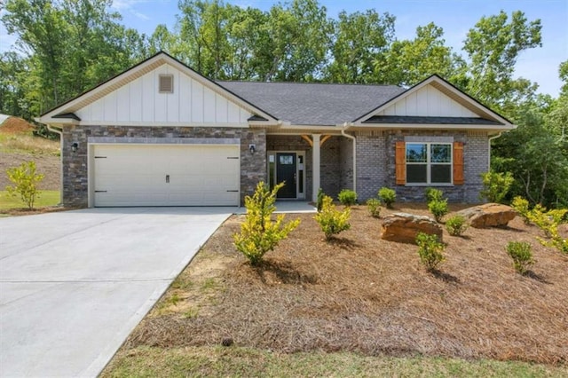 view of front of house with brick siding, driveway, a garage, and board and batten siding