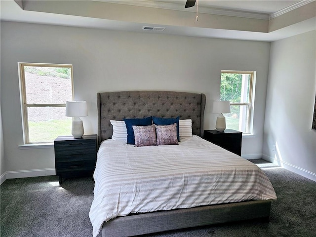 bedroom featuring baseboards, visible vents, carpet floors, and ornamental molding