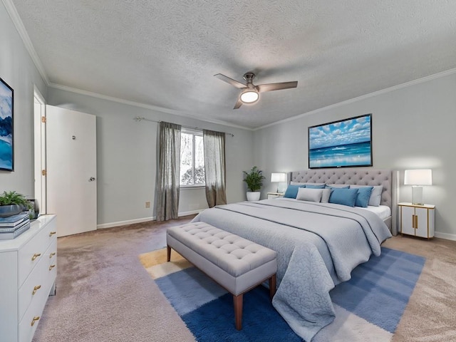 bedroom featuring a textured ceiling, ceiling fan, crown molding, and light carpet