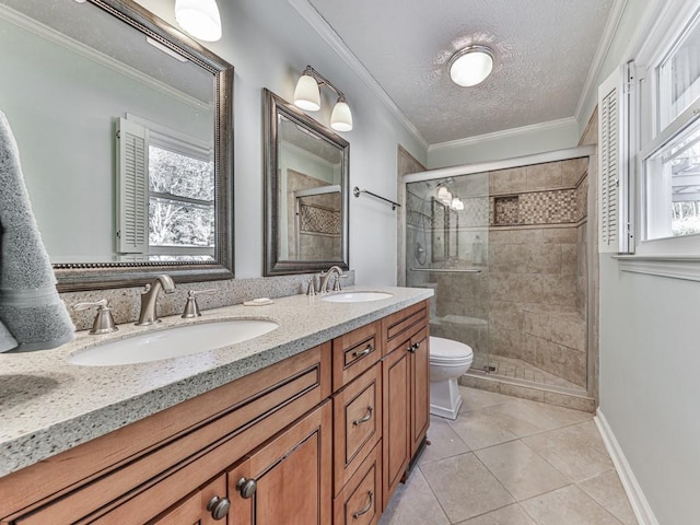 bathroom with vanity, crown molding, tile patterned flooring, a textured ceiling, and a shower with shower door