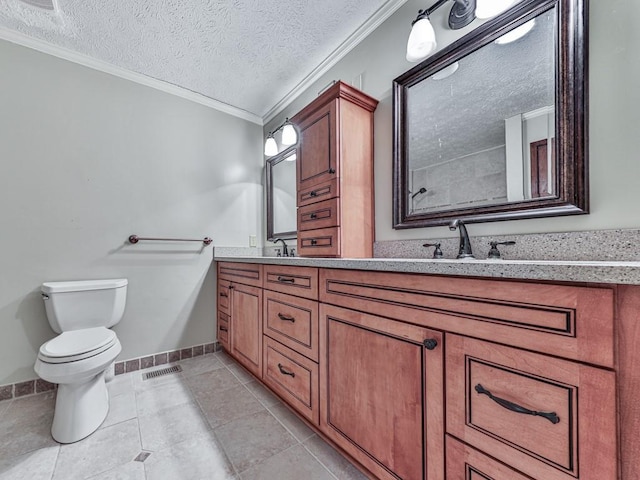 bathroom with tile patterned flooring, a textured ceiling, toilet, vanity, and ornamental molding