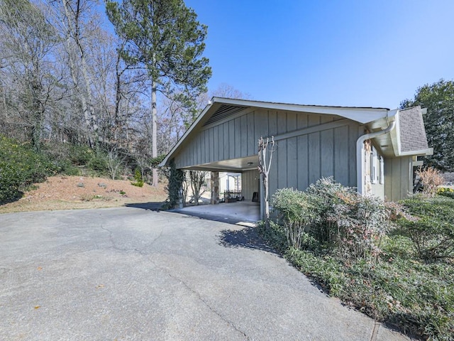 view of property exterior with a carport