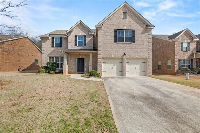 traditional home featuring a front lawn, concrete driveway, and brick siding