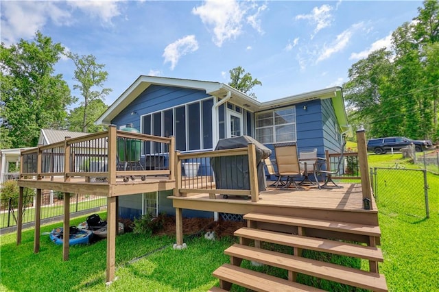 233 S Spring Rd, Eatonton, GA 31024 - rear view of property with a wooden deck and a sunroom
