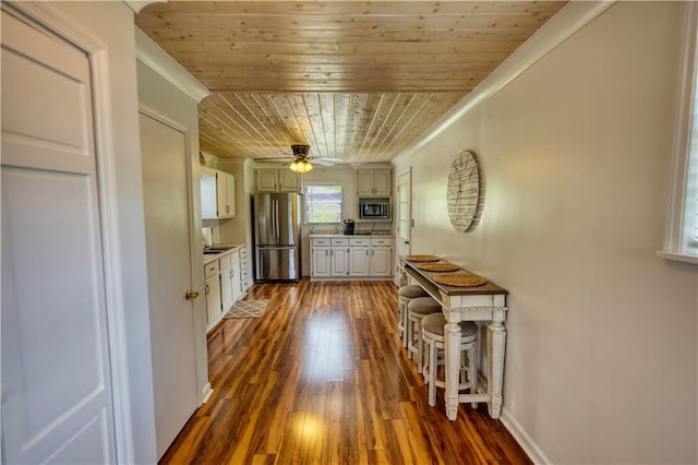 233 S Spring Rd, Eatonton, GA 31024 - hallway with wooden ceiling, dark wood finished floors, and ornamental molding