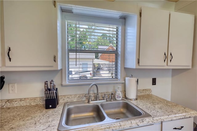 233 S Spring Rd, Eatonton, GA 31024 - kitchen featuring light countertops and white cabinetry