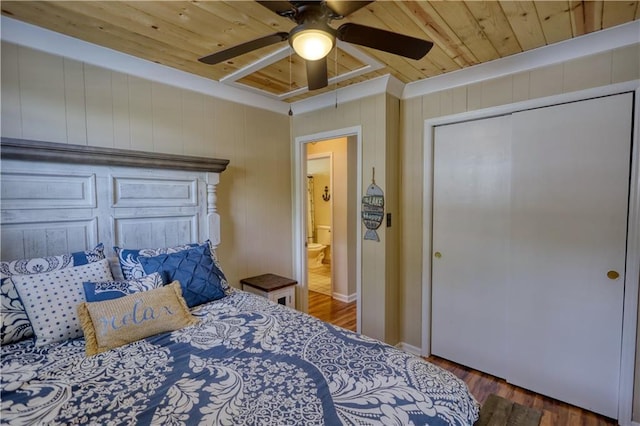 233 S Spring Rd, Eatonton, GA 31024 - bedroom with wooden ceiling, wood finished floors, ceiling fan, a closet, and wooden walls