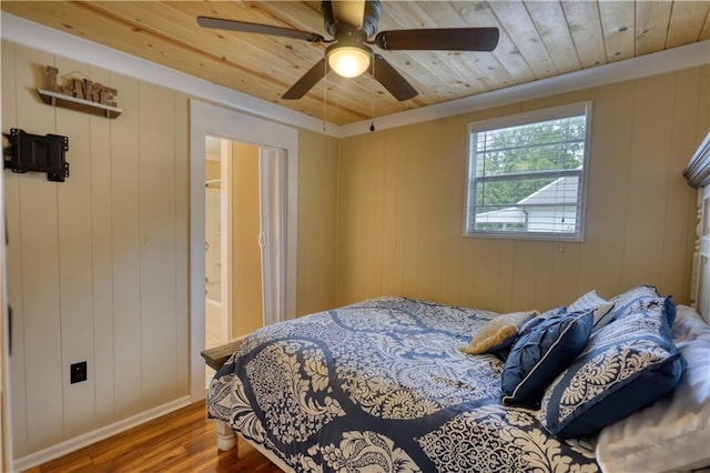 233 S Spring Rd, Eatonton, GA 31024 - bedroom with wood finished floors, wood ceiling, and a ceiling fan