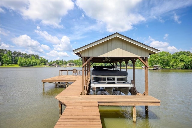 233 S Spring Rd, Eatonton, GA 31024 - dock featuring boat lift and a water view
