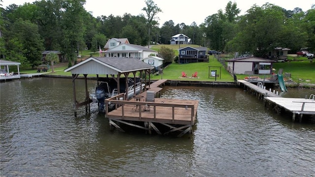 233 S Spring Rd, Eatonton, GA 31024 - dock with a water view, boat lift, a yard, and view of scattered trees