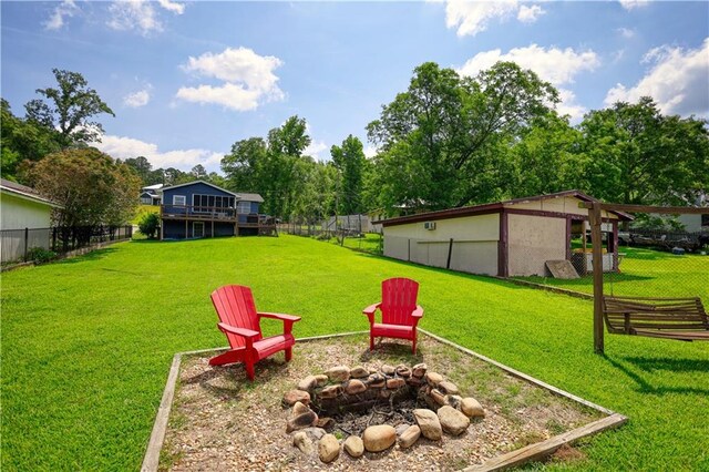 233 S Spring Rd, Eatonton, GA 31024 - view of yard featuring an outdoor fire pit