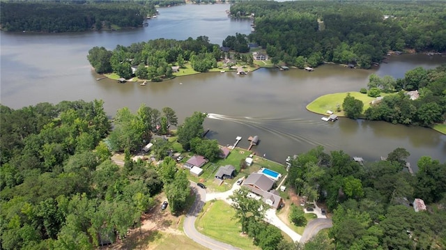 233 S Spring Rd, Eatonton, GA 31024 - aerial view of property and surrounding area featuring a nearby body of water and a heavily wooded area