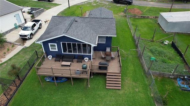 233 S Spring Rd, Eatonton, GA 31024 - back of property with a deck, a fenced backyard, and roof with shingles