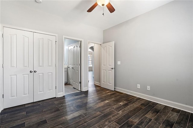 unfurnished bedroom featuring a closet, ceiling fan, and dark wood-type flooring