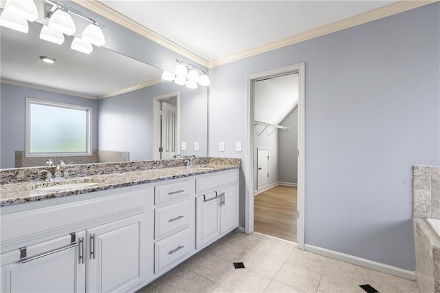 bathroom with tile patterned floors, vanity, and crown molding